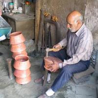 Hand hammering art on copper (Hammering)