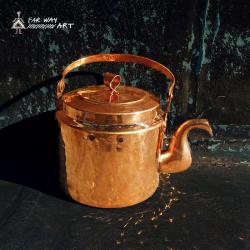 Handmade and hammered copper kettle